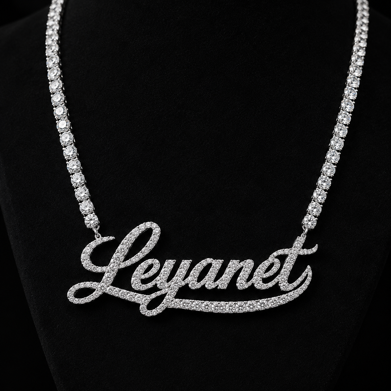 Custom Iced Out Name Necklace on Black Slate Background