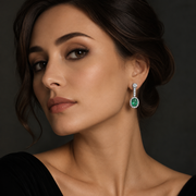 Woman Wearing Green Stone Moissanite Dangle Earrings